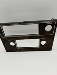 Used Gm 1978-83 Oldsmobile Cutlass Woodgrain Radio Suround Plate Bezel #557360. Fixed Price $85.00.