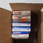 Various Sets Automotive Spark Plugs Gm 5.7, Ford 5.4. Fixed Price $35.00.