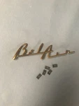 1955-56 Chevy Belair Speaker Grill Script. Fixed Price $25.00.