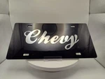"chevy" Plate (thick Plastic) Mirror On Black - Gm Official Licensed. Fixed Price $22.90.